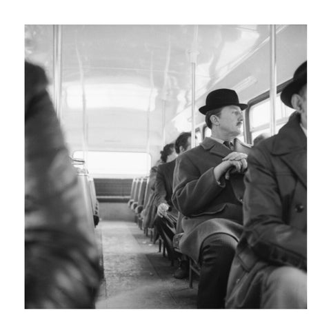 A City gent on the top deck of a London bus 20th century