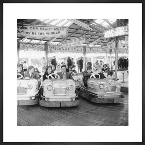 Couples on the dodgems ride Battersea Park fun fair 1966