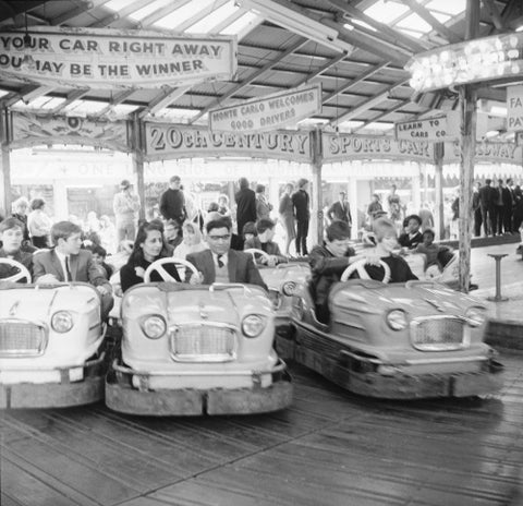 Couples on the dodgems ride Battersea Park fun fair 1966