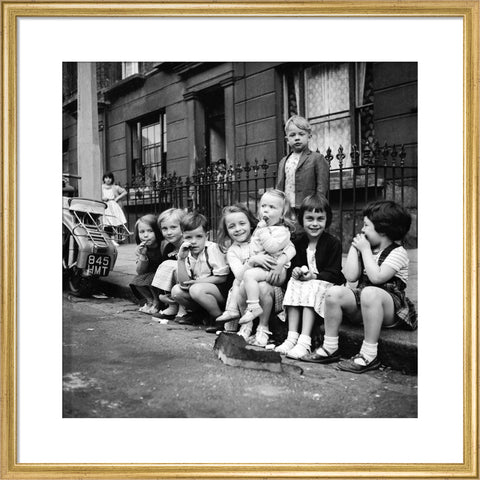 Children sitting on the curb Maida Vale 1960