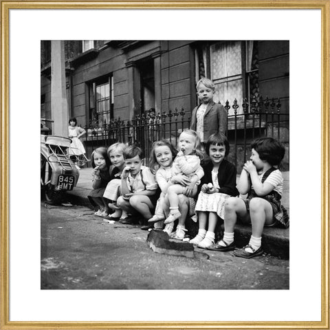 Children sitting on the curb Maida Vale 1960