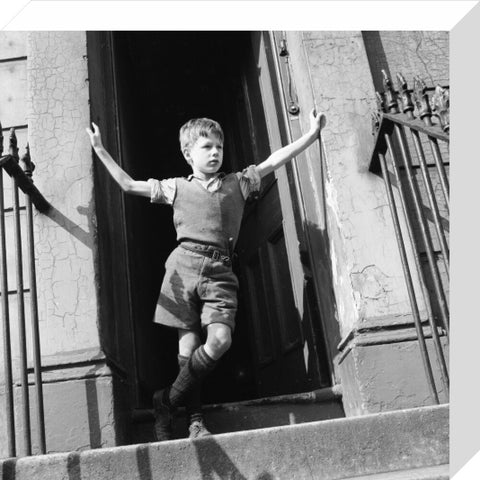 Boy standing in open doorway 1957