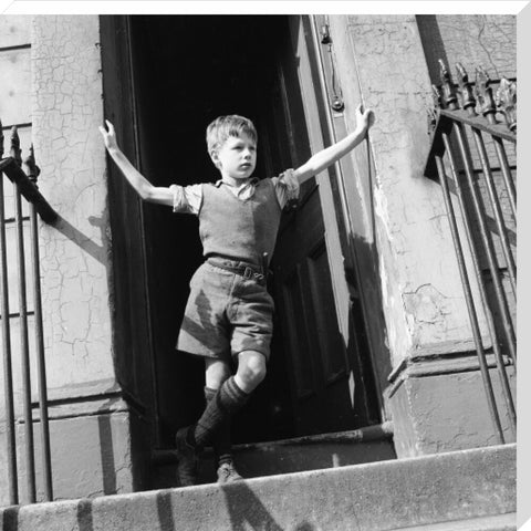 Boy standing in open doorway 1957