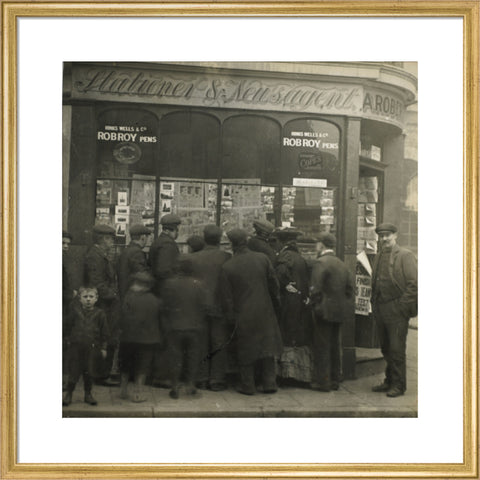 A crowd gathered around an East End newsagents window display c.1900