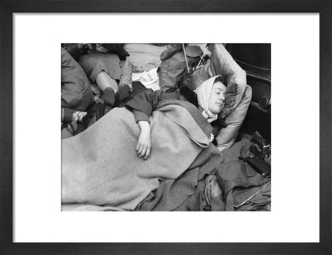 A woman camps out on the street for Queen Elizabeth's Coronation 1953