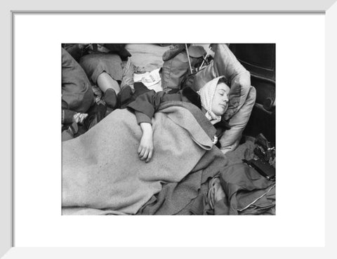 A woman camps out on the street for Queen Elizabeth's Coronation 1953