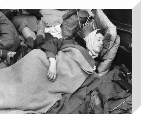 A woman camps out on the street for Queen Elizabeth's Coronation 1953