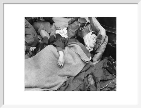 A woman camps out on the street for Queen Elizabeth's Coronation 1953