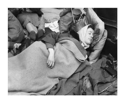 A woman camps out on the street for Queen Elizabeth's Coronation 1953