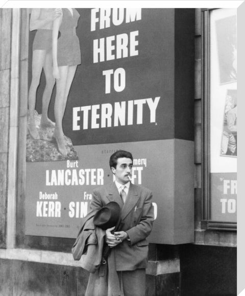 A man standing outside the Odeon cinema at Hyde Park Corner c. 1953