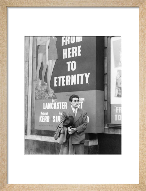 A man standing outside the Odeon cinema at Hyde Park Corner c. 1953