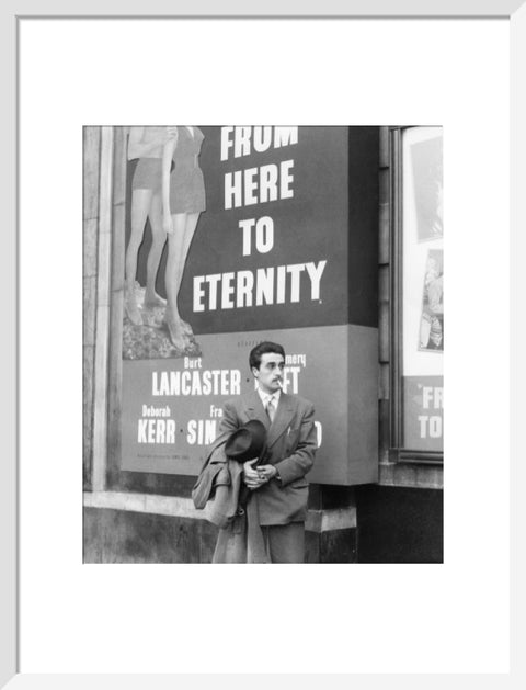 A man standing outside the Odeon cinema at Hyde Park Corner c. 1953