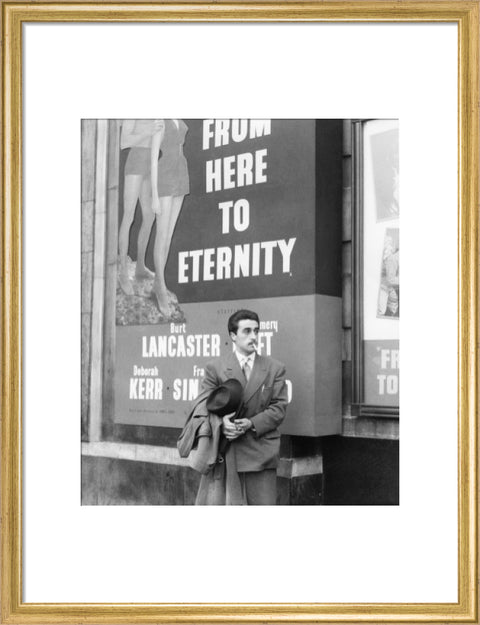 A man standing outside the Odeon cinema at Hyde Park Corner c. 1953