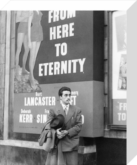 A man standing outside the Odeon cinema at Hyde Park Corner c. 1953