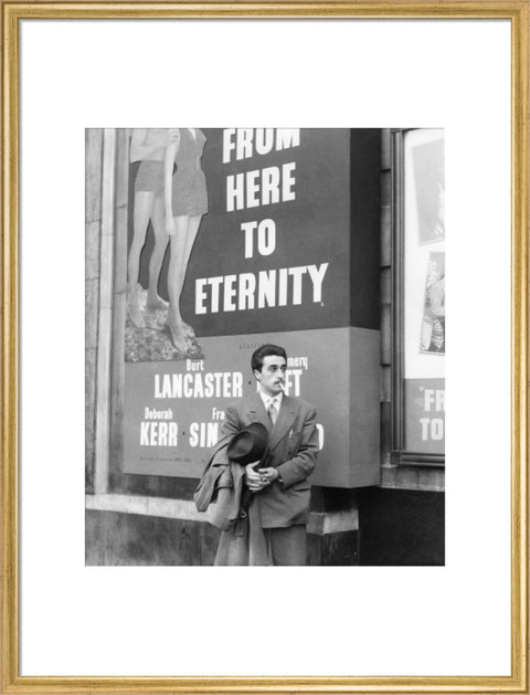 A man standing outside the Odeon cinema at Hyde Park Corner c. 1953