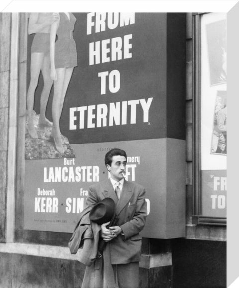 A man standing outside the Odeon cinema at Hyde Park Corner c. 1953