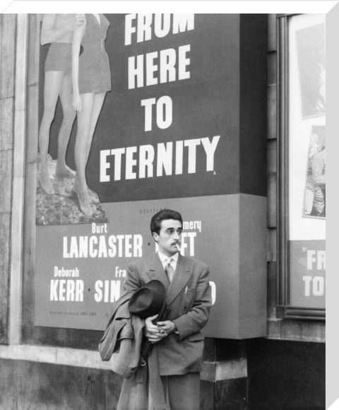 A man standing outside the Odeon cinema at Hyde Park Corner c. 1953