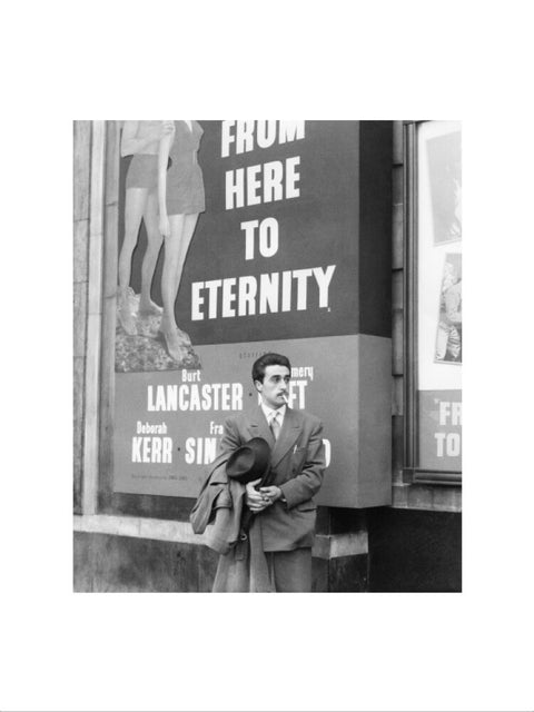 A man standing outside the Odeon cinema at Hyde Park Corner c. 1953