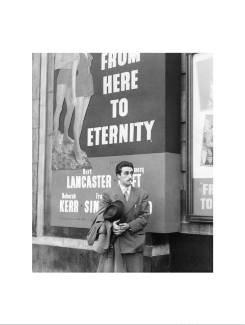 A man standing outside the Odeon cinema at Hyde Park Corner c. 1953