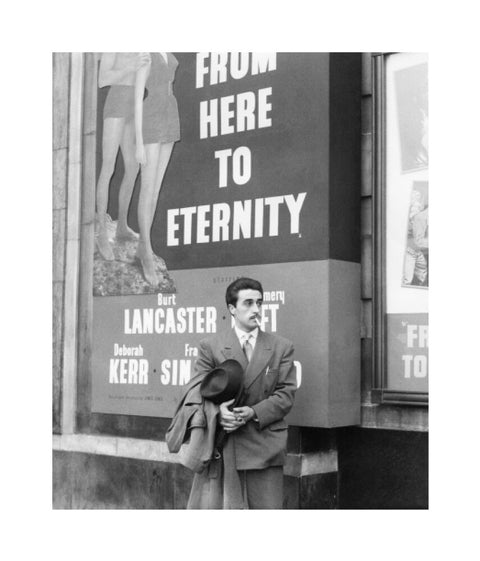 A man standing outside the Odeon cinema at Hyde Park Corner c. 1953