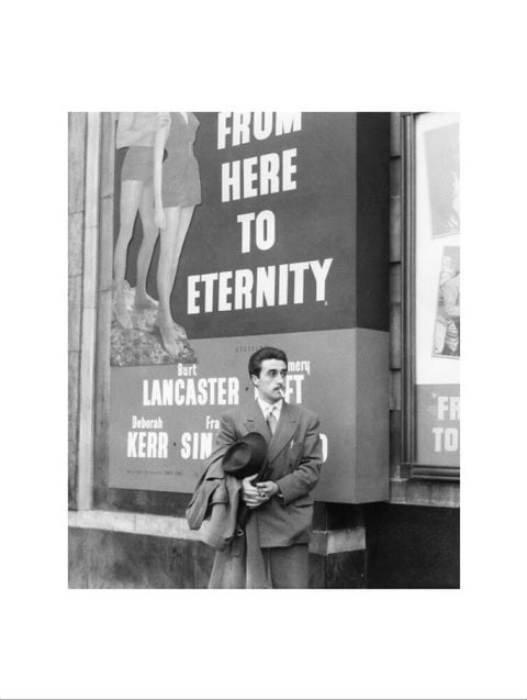 A man standing outside the Odeon cinema at Hyde Park Corner c. 1953