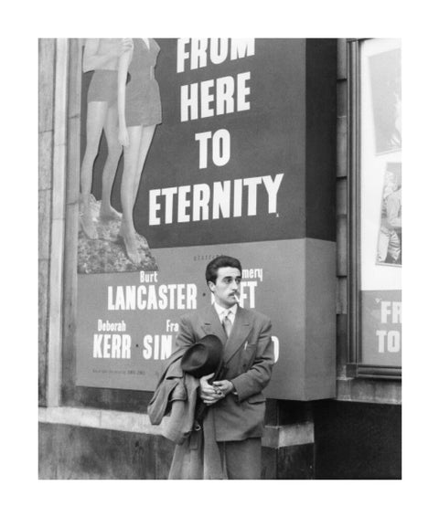 A man standing outside the Odeon cinema at Hyde Park Corner c. 1953