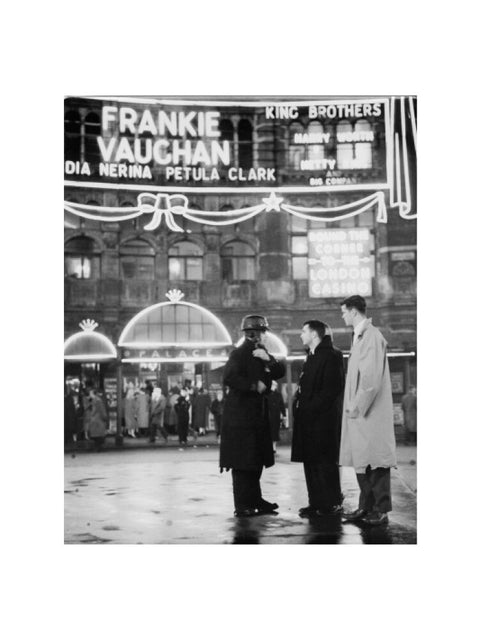 A group of men talking outside the Palace Theatre Shaftsbury Avenue c. 1955