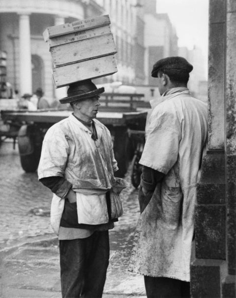 Two men in conversation outside Billingsgate Fish Market 1958