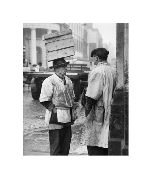 Two men in conversation outside Billingsgate Fish Market 1958