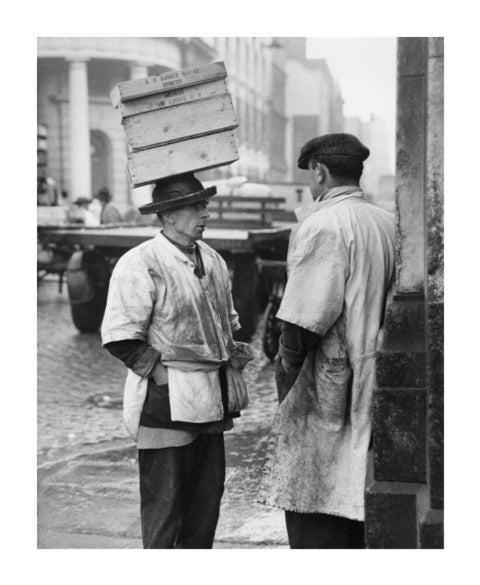 Two men in conversation outside Billingsgate Fish Market 1958