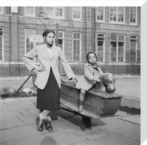 East London Afro-Caribbean child and mother in playground 1952