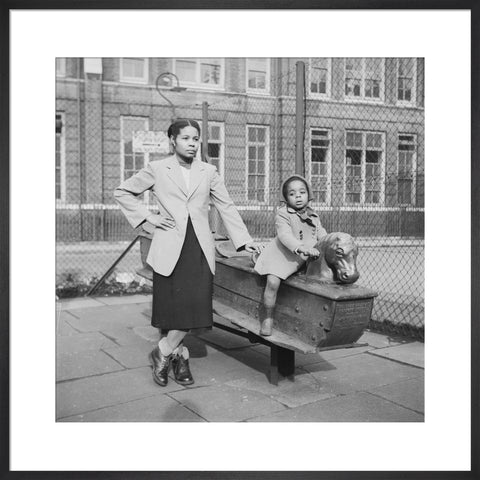 East London Afro-Caribbean child and mother in playground 1952
