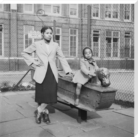 East London Afro-Caribbean child and mother in playground 1952