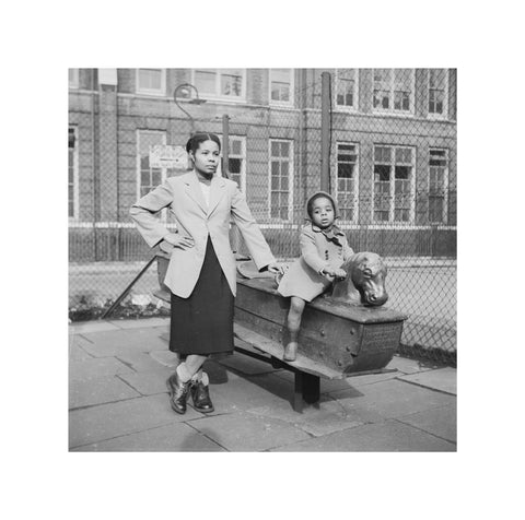 East London Afro-Caribbean child and mother in playground 1952