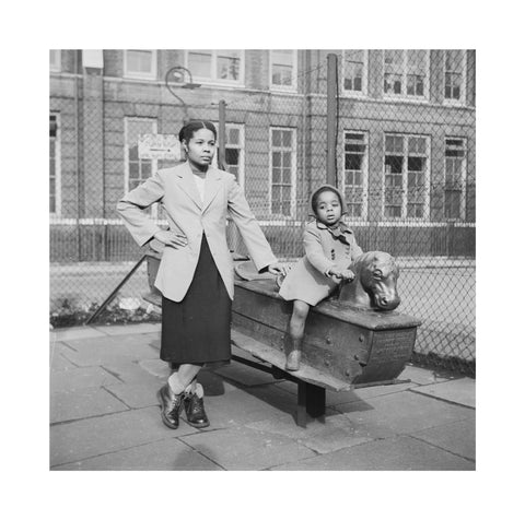 East London Afro-Caribbean child and mother in playground 1952