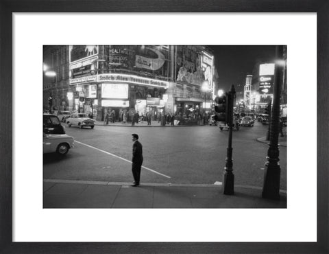 Lone man in Piccadilly at night 1960