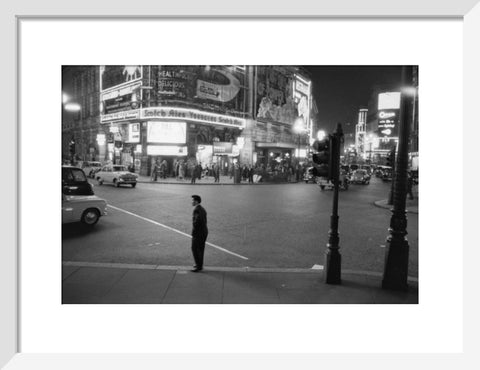 Lone man in Piccadilly at night 1960