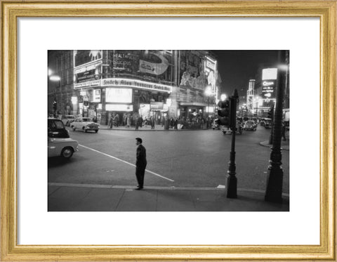 Lone man in Piccadilly at night 1960