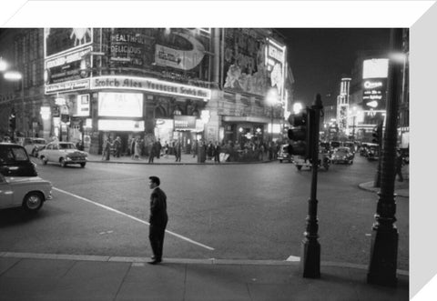 Lone man in Piccadilly at night 1960