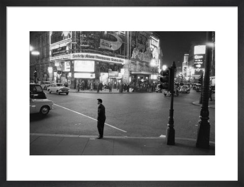 Lone man in Piccadilly at night 1960