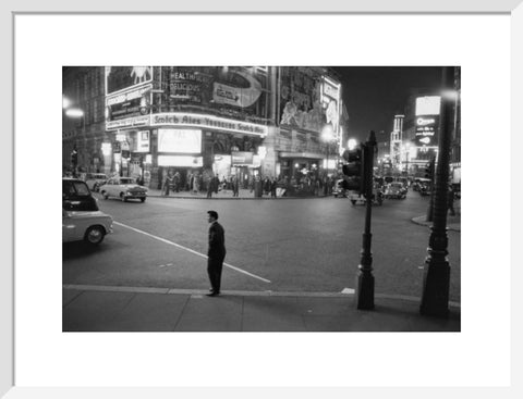 Lone man in Piccadilly at night 1960