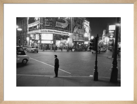 Lone man in Piccadilly at night 1960