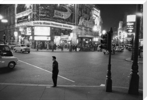 Lone man in Piccadilly at night 1960