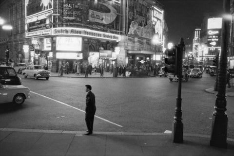 Lone man in Piccadilly at night 1960