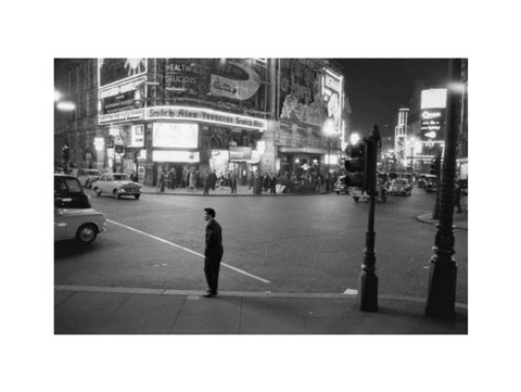 Lone man in Piccadilly at night 1960