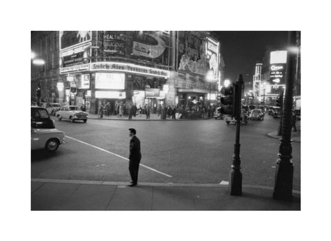 Lone man in Piccadilly at night 1960