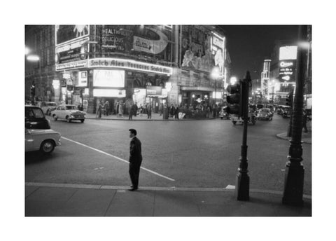 Lone man in Piccadilly at night 1960