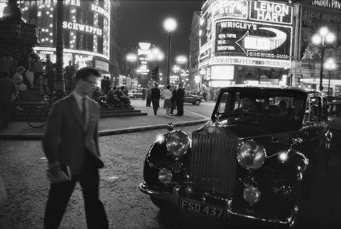 A man cuts across traffic at Piccadilly Circus 1960