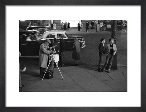 Photographer recording the nightlife c.1960