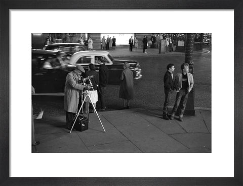 Photographer recording the nightlife c.1960